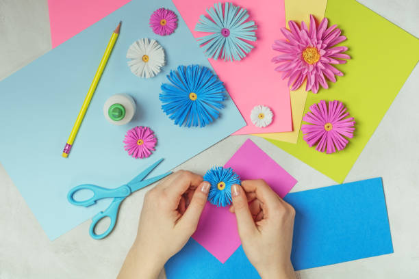 Making paper flowers art. DIY concept. Pastel colors, flat lay. Making paper flowers art. DIY concept. Pastel colors, flat lay.